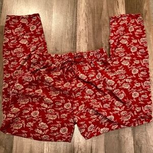 Cropped red cotton pants with white flowers
